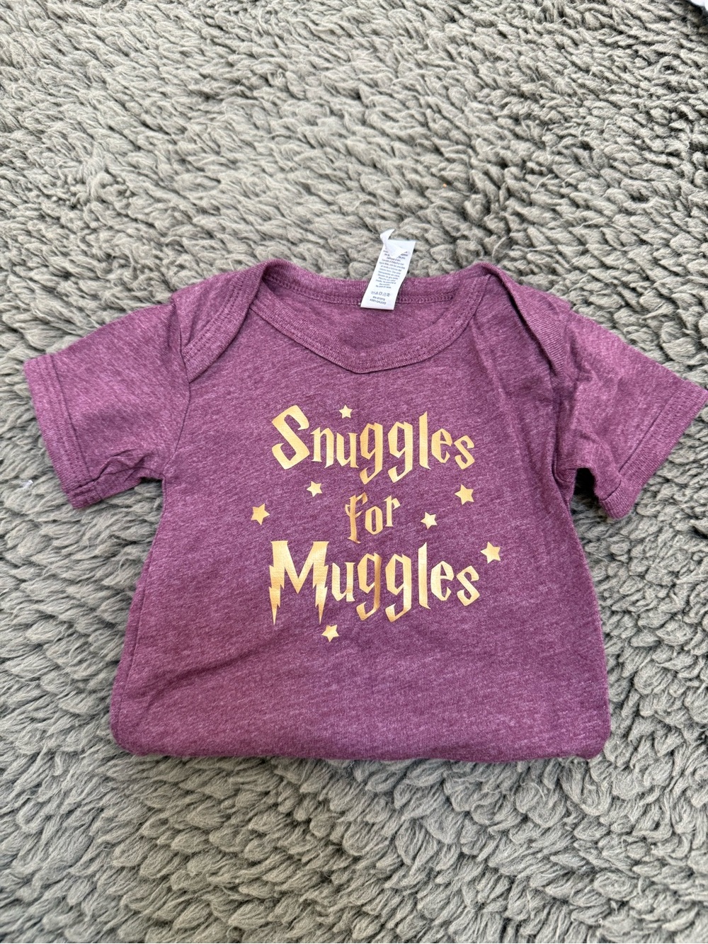 Harry Potter: “Snuggles for Muggles” Baby Tee - Purple with Gold Print
